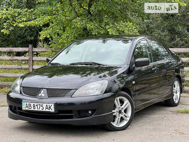 Чорний Міцубісі Lancer, об'ємом двигуна 2 л та пробігом 234 тис. км за 4999 $, фото 6 на Automoto.ua