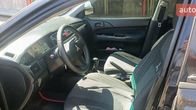 Чорний Міцубісі Lancer, об'ємом двигуна 1.6 л та пробігом 240 тис. км за 3900 $, фото 2 на Automoto.ua