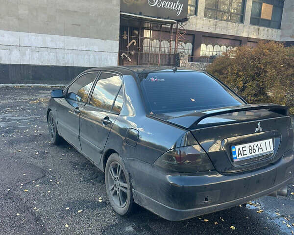 Чорний Міцубісі Lancer, об'ємом двигуна 2 л та пробігом 270 тис. км за 3300 $, фото 5 на Automoto.ua