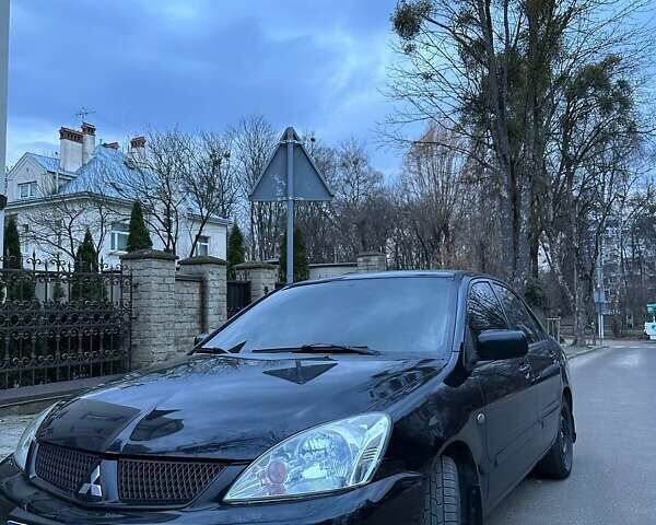 Черный Мицубиси Лансер, объемом двигателя 1.6 л и пробегом 306 тыс. км за 4800 $, фото 1 на Automoto.ua