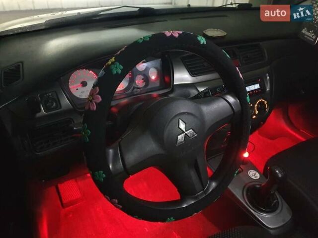 Чорний Міцубісі Lancer, об'ємом двигуна 1.58 л та пробігом 222 тис. км за 2999 $, фото 6 на Automoto.ua