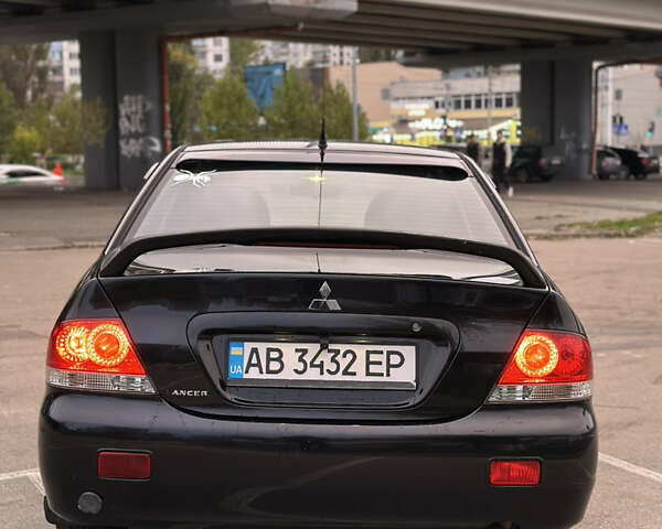 Чорний Міцубісі Lancer, об'ємом двигуна 1.58 л та пробігом 230 тис. км за 4350 $, фото 3 на Automoto.ua