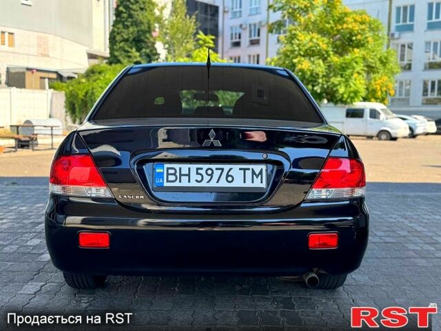 Чорний Міцубісі Lancer, об'ємом двигуна 1.6 л та пробігом 176 тис. км за 3777 $, фото 3 на Automoto.ua