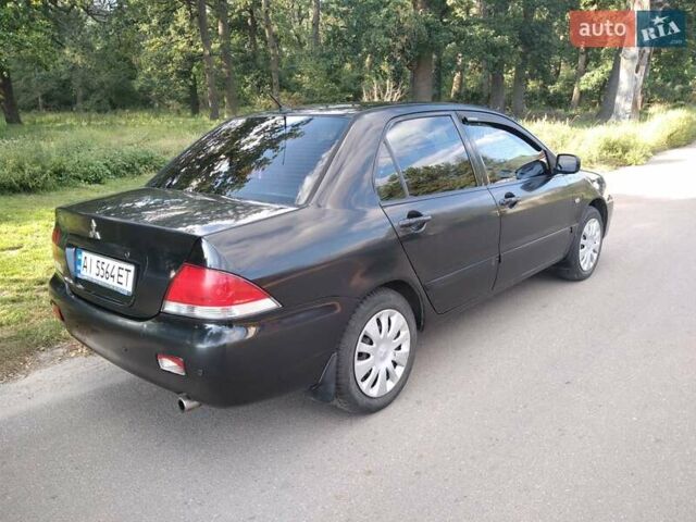 Чорний Міцубісі Lancer, об'ємом двигуна 1.58 л та пробігом 520 тис. км за 3400 $, фото 1 на Automoto.ua