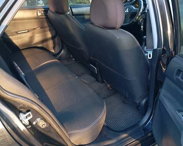 Чорний Міцубісі Lancer, об'ємом двигуна 1.6 л та пробігом 325 тис. км за 4750 $, фото 9 на Automoto.ua