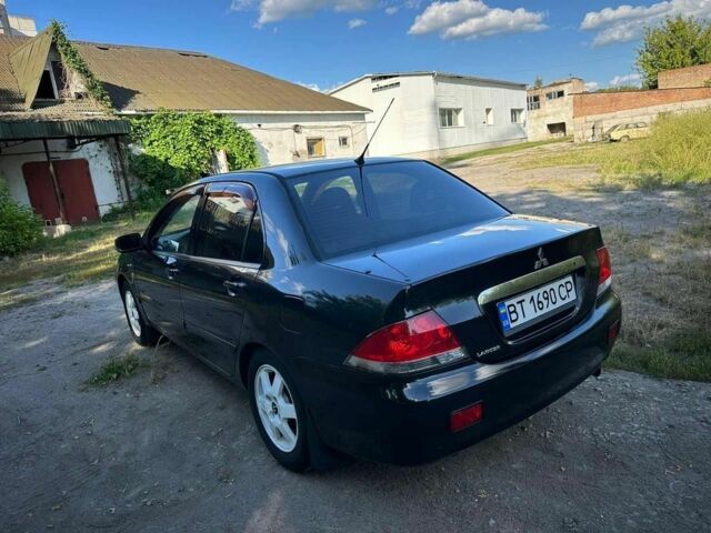 Черный Мицубиси Лансер, объемом двигателя 1.6 л и пробегом 289 тыс. км за 3200 $, фото 7 на Automoto.ua