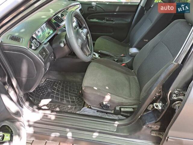 Чорний Міцубісі Lancer, об'ємом двигуна 1.58 л та пробігом 280 тис. км за 3950 $, фото 15 на Automoto.ua