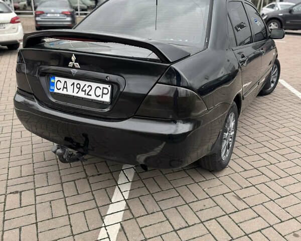 Черный Мицубиси Лансер, объемом двигателя 1.58 л и пробегом 370 тыс. км за 3500 $, фото 5 на Automoto.ua