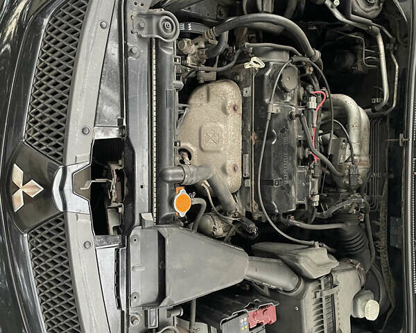 Чорний Міцубісі Lancer, об'ємом двигуна 1.6 л та пробігом 240 тис. км за 4599 $, фото 11 на Automoto.ua