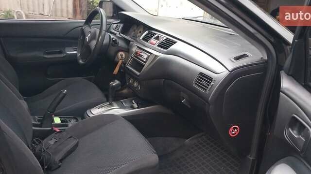 Чорний Міцубісі Lancer, об'ємом двигуна 1.59 л та пробігом 185 тис. км за 4900 $, фото 3 на Automoto.ua