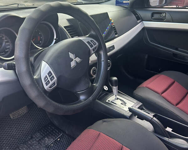 Черный Мицубиси Лансер, объемом двигателя 2 л и пробегом 208 тыс. км за 6500 $, фото 9 на Automoto.ua