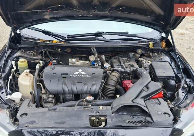 Черный Мицубиси Лансер, объемом двигателя 2 л и пробегом 230 тыс. км за 7100 $, фото 13 на Automoto.ua