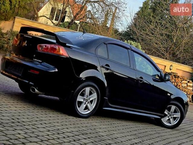 Чорний Міцубісі Lancer, об'ємом двигуна 2 л та пробігом 260 тис. км за 6555 $, фото 3 на Automoto.ua