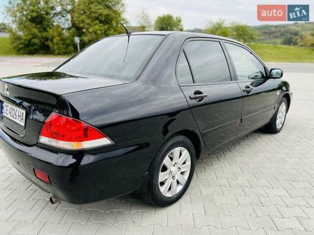 Чорний Міцубісі Lancer, об'ємом двигуна 1.6 л та пробігом 243 тис. км за 4950 $, фото 12 на Automoto.ua
