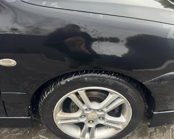 Чорний Міцубісі Lancer, об'ємом двигуна 2 л та пробігом 210 тис. км за 5500 $, фото 6 на Automoto.ua