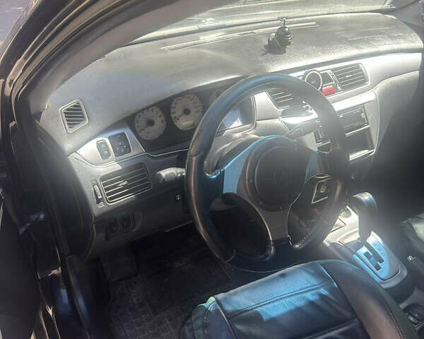 Чорний Міцубісі Lancer, об'ємом двигуна 2 л та пробігом 210 тис. км за 5500 $, фото 44 на Automoto.ua