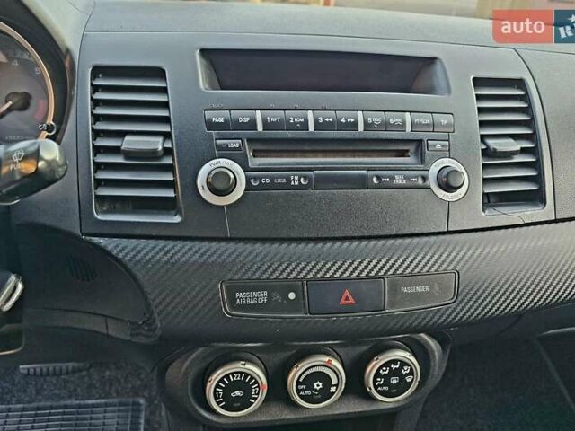 Черный Мицубиси Лансер, объемом двигателя 2 л и пробегом 260 тыс. км за 6555 $, фото 27 на Automoto.ua