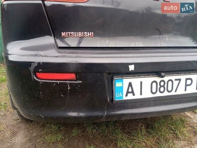 Черный Мицубиси Лансер, объемом двигателя 2 л и пробегом 277 тыс. км за 4650 $, фото 11 на Automoto.ua
