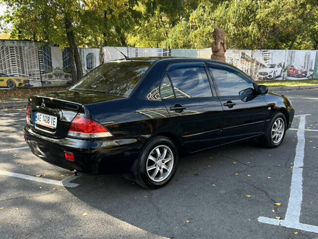 Чорний Міцубісі Lancer, об'ємом двигуна 1.58 л та пробігом 175 тис. км за 5200 $, фото 2 на Automoto.ua