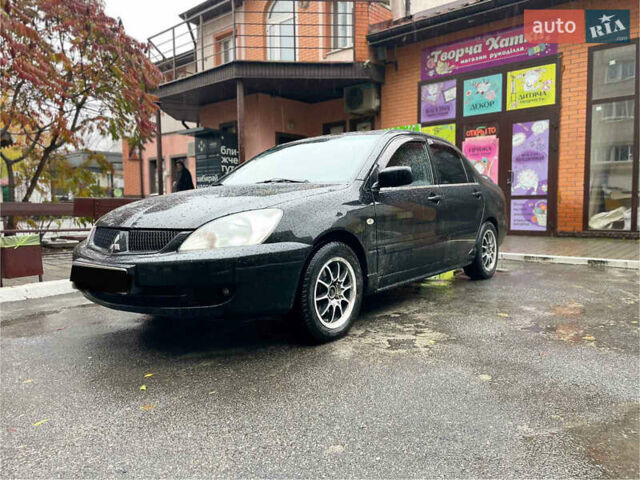 Черный Мицубиси Лансер, объемом двигателя 1.58 л и пробегом 265 тыс. км за 3550 $, фото 12 на Automoto.ua