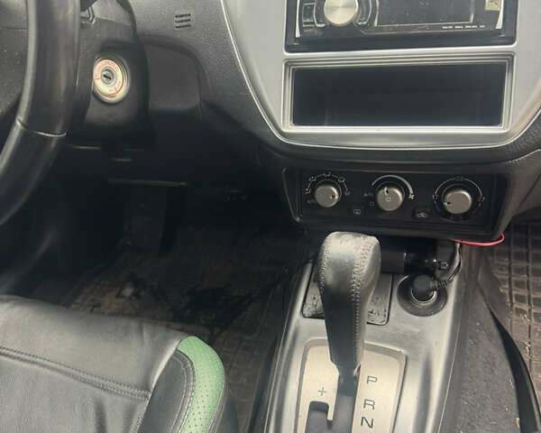 Чорний Міцубісі Lancer, об'ємом двигуна 2 л та пробігом 210 тис. км за 5500 $, фото 29 на Automoto.ua