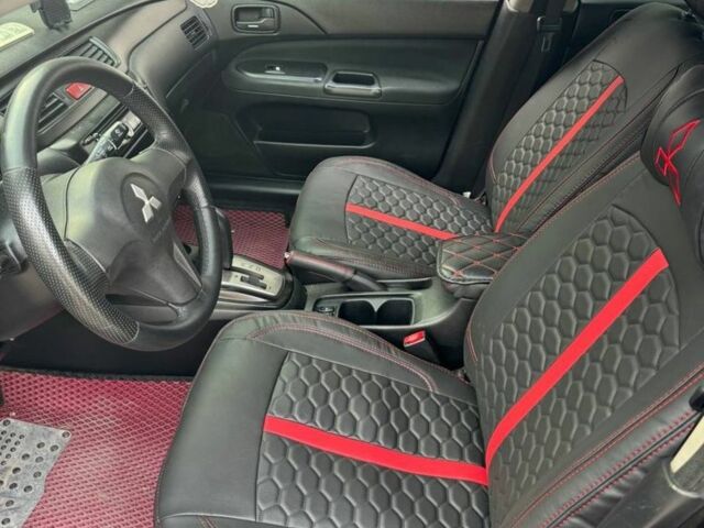 Черный Мицубиси Лансер, объемом двигателя 1.6 л и пробегом 211 тыс. км за 5600 $, фото 6 на Automoto.ua