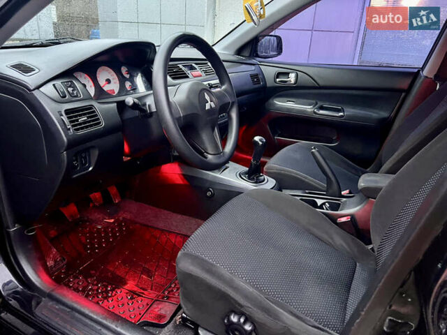 Чорний Міцубісі Lancer, об'ємом двигуна 1.6 л та пробігом 303 тис. км за 4350 $, фото 23 на Automoto.ua