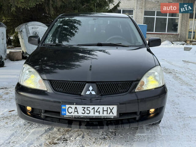 Чорний Міцубісі Lancer, об'ємом двигуна 1.6 л та пробігом 190 тис. км за 3450 $, фото 2 на Automoto.ua