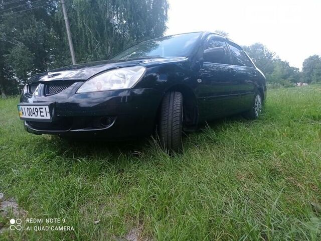 Чорний Міцубісі Lancer, об'ємом двигуна 1.58 л та пробігом 400 тис. км за 3700 $, фото 22 на Automoto.ua