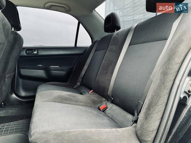 Чорний Міцубісі Lancer, об'ємом двигуна 1.6 л та пробігом 243 тис. км за 4950 $, фото 41 на Automoto.ua