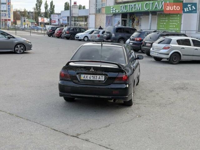Чорний Міцубісі Lancer, об'ємом двигуна 2 л та пробігом 152 тис. км за 5500 $, фото 7 на Automoto.ua