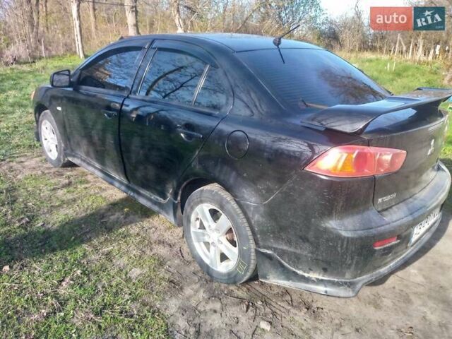 Чорний Міцубісі Lancer, об'ємом двигуна 2 л та пробігом 180 тис. км за 7300 $, фото 1 на Automoto.ua