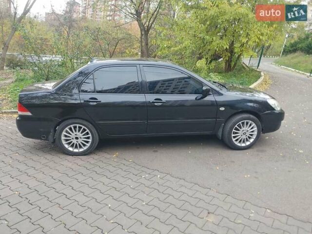 Чорний Міцубісі Lancer, об'ємом двигуна 1.58 л та пробігом 190 тис. км за 3750 $, фото 20 на Automoto.ua