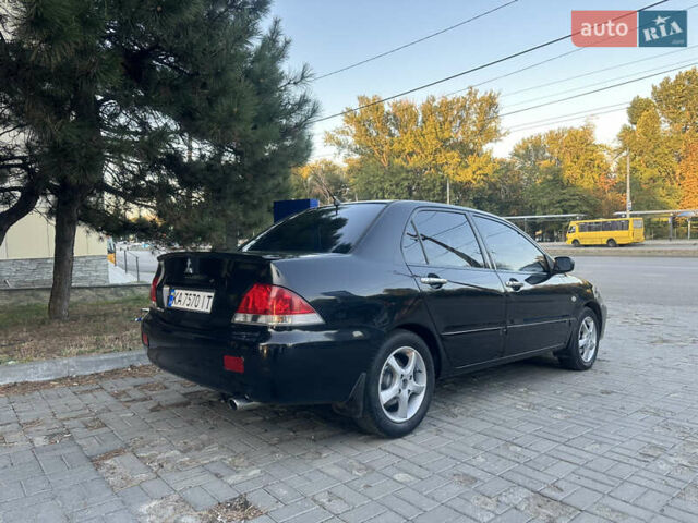 Черный Мицубиси Лансер, объемом двигателя 1.59 л и пробегом 269 тыс. км за 4999 $, фото 4 на Automoto.ua