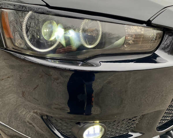 Черный Мицубиси Лансер, объемом двигателя 2 л и пробегом 164 тыс. км за 8300 $, фото 4 на Automoto.ua