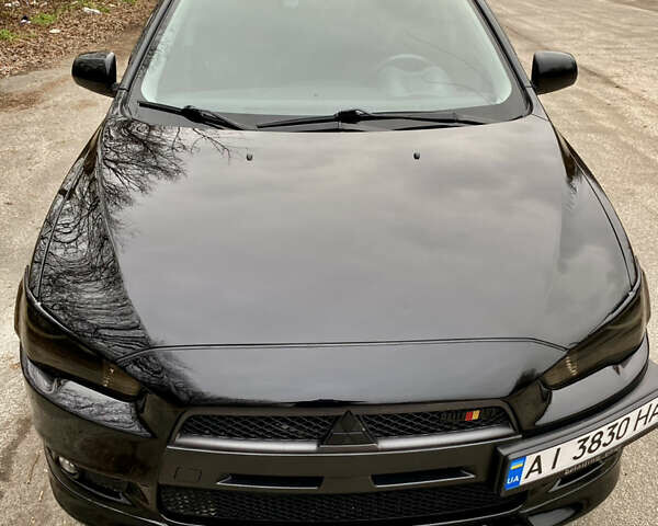 Черный Мицубиси Лансер, объемом двигателя 2 л и пробегом 164 тыс. км за 8300 $, фото 1 на Automoto.ua