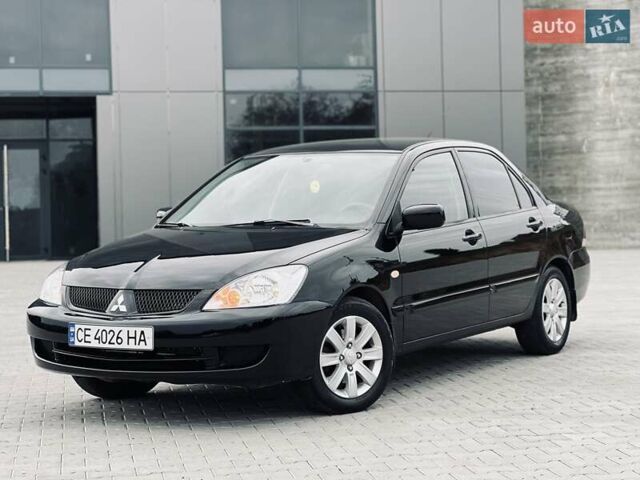 Чорний Міцубісі Lancer, об'ємом двигуна 1.6 л та пробігом 243 тис. км за 4950 $, фото 1 на Automoto.ua
