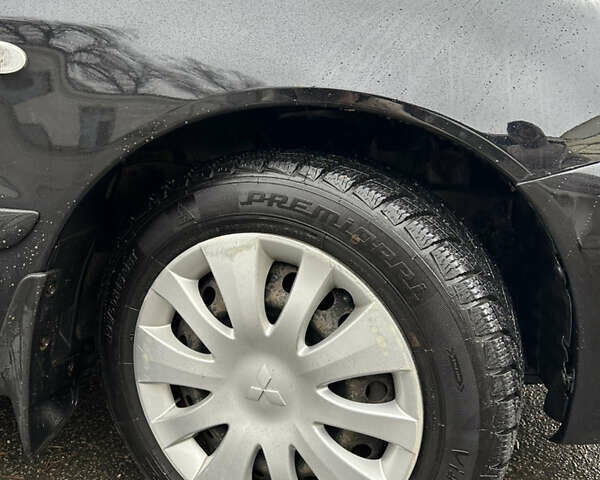 Черный Мицубиси Лансер, объемом двигателя 1.58 л и пробегом 254 тыс. км за 5000 $, фото 7 на Automoto.ua