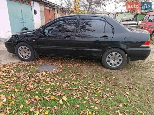 Чорний Міцубісі Lancer, об'ємом двигуна 1.58 л та пробігом 227 тис. км за 4100 $, фото 6 на Automoto.ua