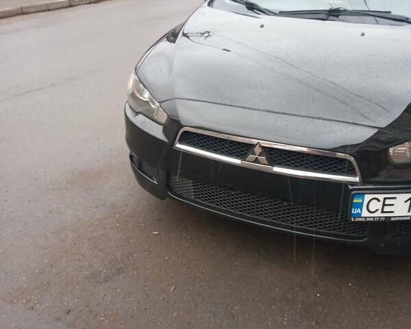 Черный Мицубиси Лансер, объемом двигателя 2 л и пробегом 267 тыс. км за 6000 $, фото 24 на Automoto.ua