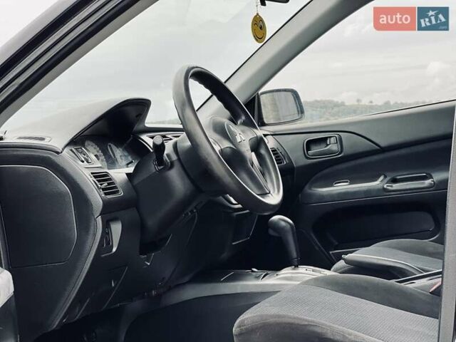 Чорний Міцубісі Lancer, об'ємом двигуна 1.6 л та пробігом 243 тис. км за 4950 $, фото 35 на Automoto.ua