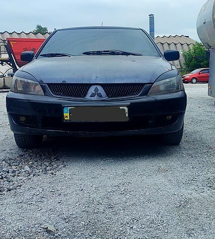 Чорний Міцубісі Lancer, об'ємом двигуна 2 л та пробігом 200 тис. км за 1800 $, фото 4 на Automoto.ua