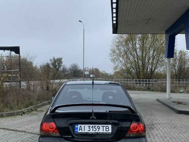 Черный Мицубиси Лансер, объемом двигателя 1.6 л и пробегом 263 тыс. км за 2900 $, фото 5 на Automoto.ua