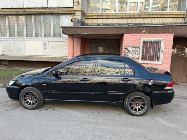 Черный Мицубиси Лансер, объемом двигателя 1.6 л и пробегом 211 тыс. км за 5600 $, фото 4 на Automoto.ua