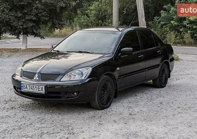 Черный Мицубиси Лансер, объемом двигателя 1.6 л и пробегом 226 тыс. км за 4800 $, фото 15 на Automoto.ua