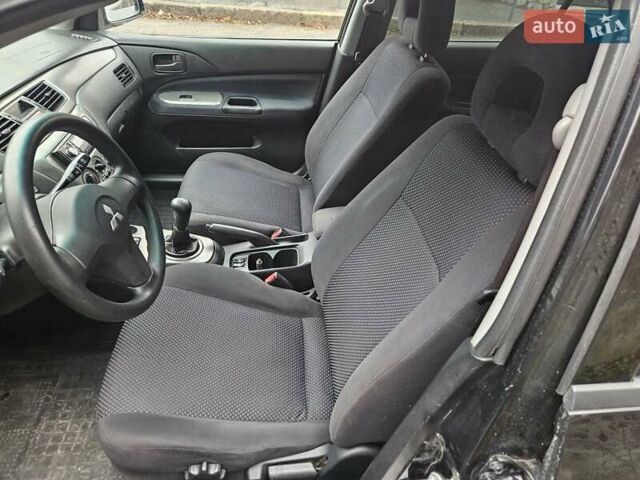 Черный Мицубиси Лансер, объемом двигателя 1.6 л и пробегом 152 тыс. км за 4999 $, фото 9 на Automoto.ua