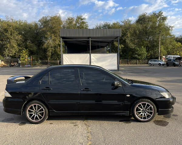 Чорний Міцубісі Lancer, об'ємом двигуна 2 л та пробігом 280 тис. км за 4600 $, фото 13 на Automoto.ua
