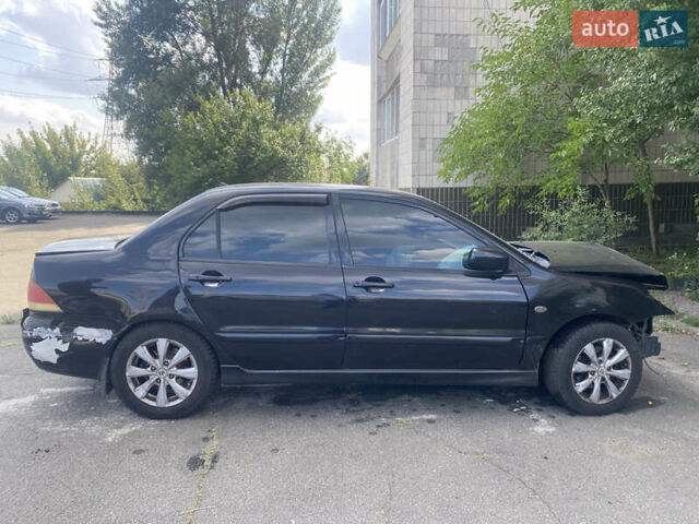 Чорний Міцубісі Lancer, об'ємом двигуна 1.6 л та пробігом 397 тис. км за 1500 $, фото 8 на Automoto.ua