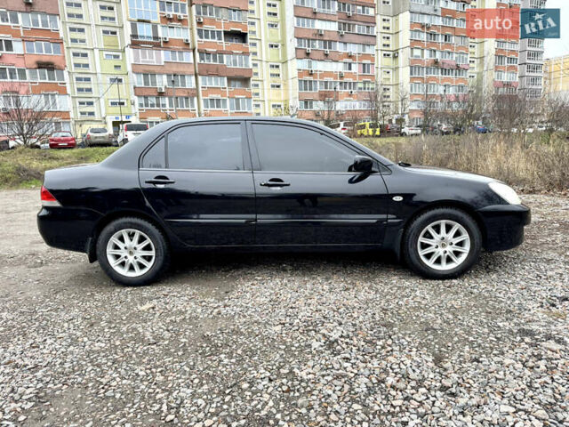 Черный Мицубиси Лансер, объемом двигателя 1.6 л и пробегом 216 тыс. км за 4990 $, фото 5 на Automoto.ua