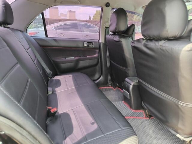 Черный Мицубиси Лансер, объемом двигателя 2 л и пробегом 161 тыс. км за 4500 $, фото 3 на Automoto.ua